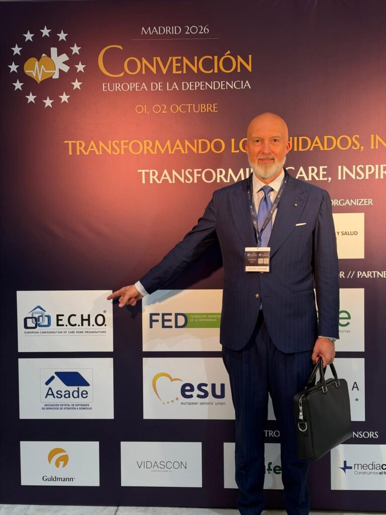 Participant at the partner wall with the E.C.H.O. logo, European Convention on Long-Term Care, Madrid 2026